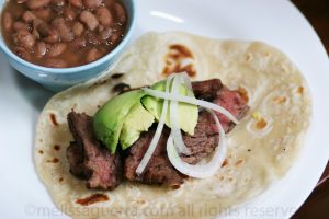 Plate of Fajitas with a small bowl of beans