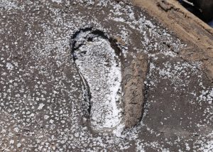 Human foot print filled with salt at El Sal del Rey
