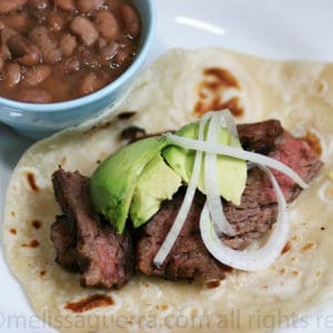 Plate of Fajitas with a small bowl of beans