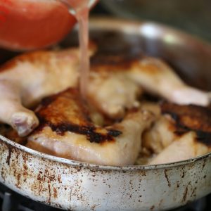 Adding the tomato broth