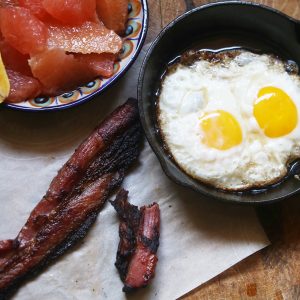 Home Cured Bacon, ranch raised eggs fried in bacon drippings, and ranch raised Ruby Red grapefruit