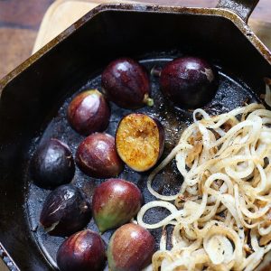 Figs browning in pan with onions