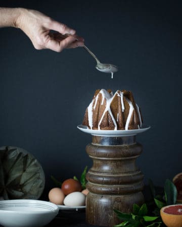 Glazing a Cardamom Spice Pecan Pound Cake with Ruby Red Glaze