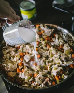 Pouring flour slurry into pan