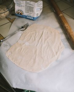 Rosemary Sea Salt Crackers with Truffle Oil dough pricked with a fork