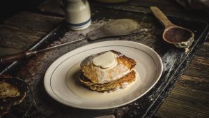 Stack of Oatmeal Pancakes with Pears and Vanilla Cream