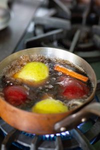 Pan of simmering cinnamon poached pears