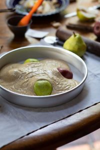 Batter poured over pears for Pear Cake with Black Pepper and Buttermilk