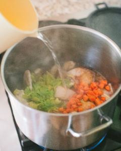 Adding water to Roasted Poblano Chicken and Cilantro Dumplings