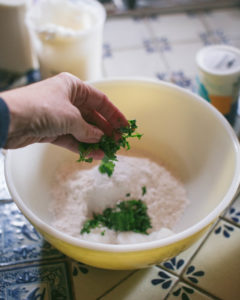 Adding cilantro to the dumpling dough for Roasted Poblano Chicken and Cilantro Dumplings