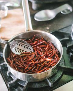 Stirring chiles for Salsa Macha