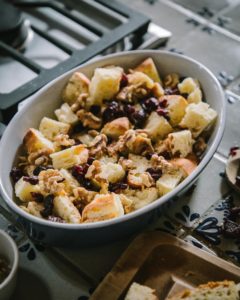 Layering bread and fruit in baking dish