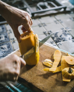 Carving skin off of winter squash