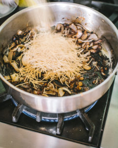 Add uncooked fideo to pan