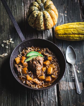 Stew garnished with avocado