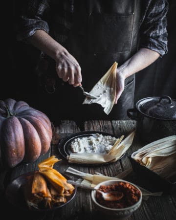 Spreading preparped masa on a corn husk