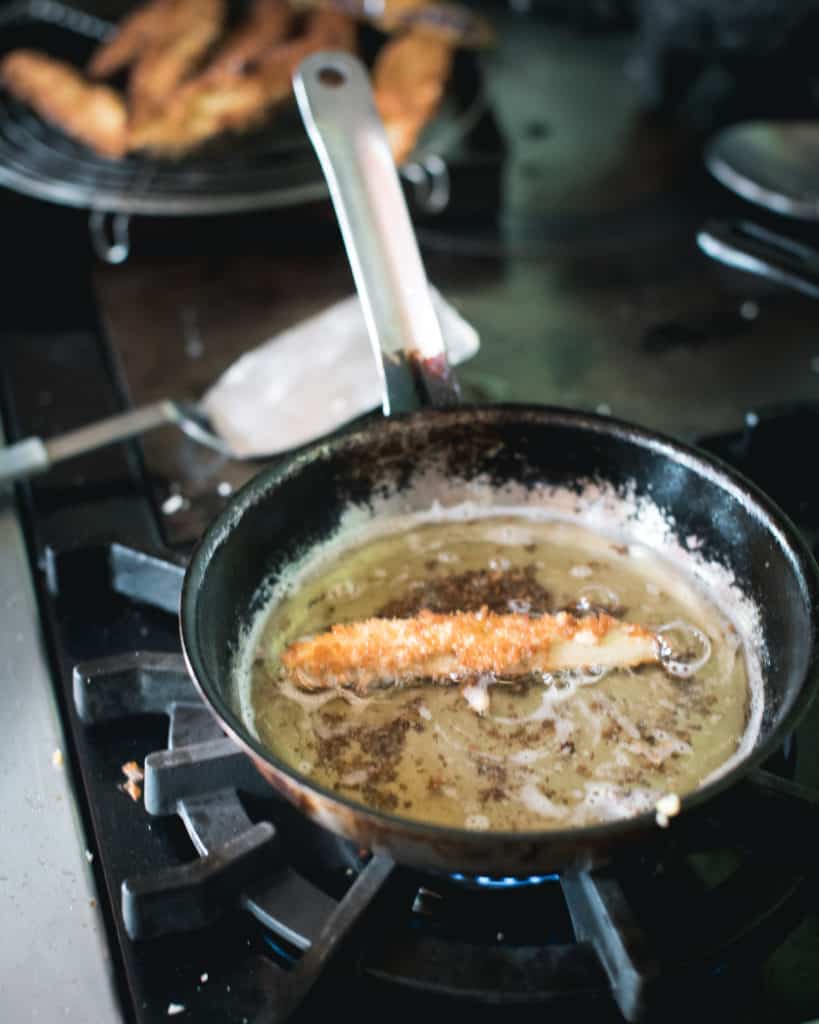 eggplant wedge frying in vegetable oil