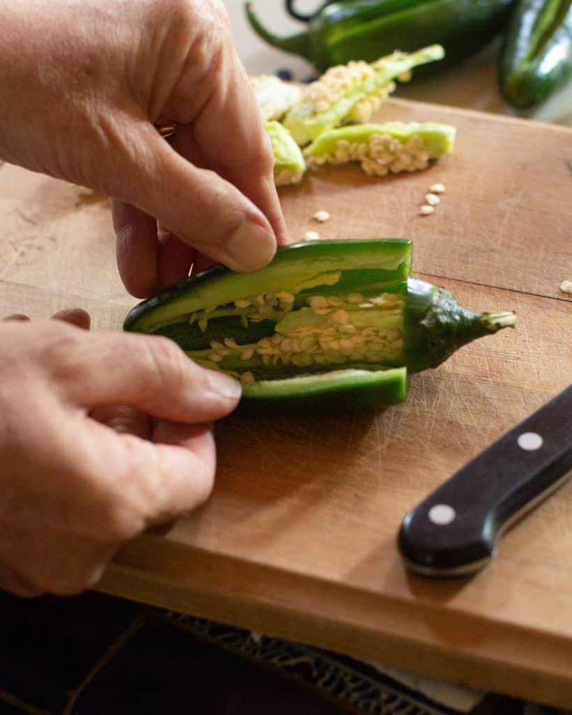 hands preparing jalapeño 