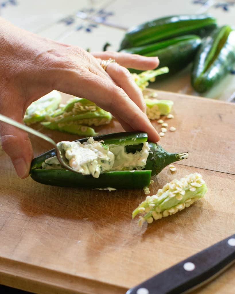 filling jalapeño with cream cheese