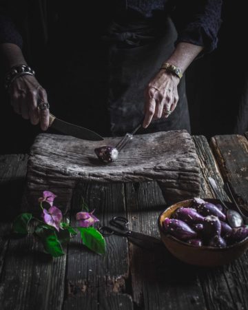 hands cutting cactus pear