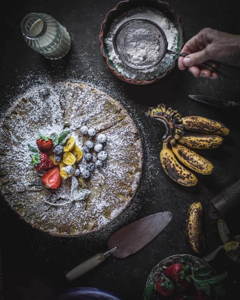 dusting cake with sugar