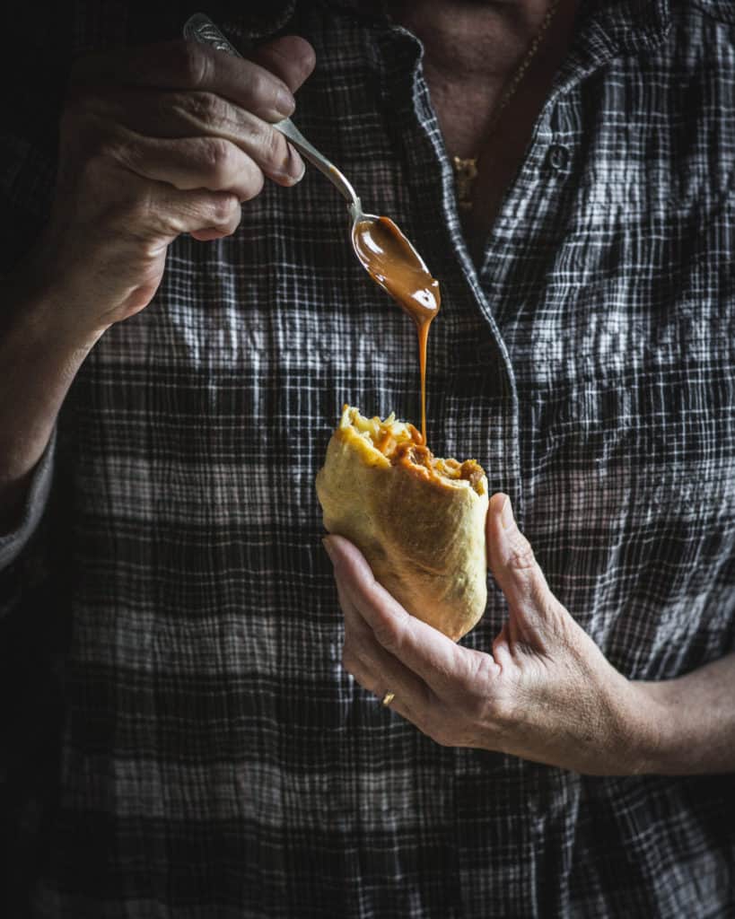 hand holding empanada