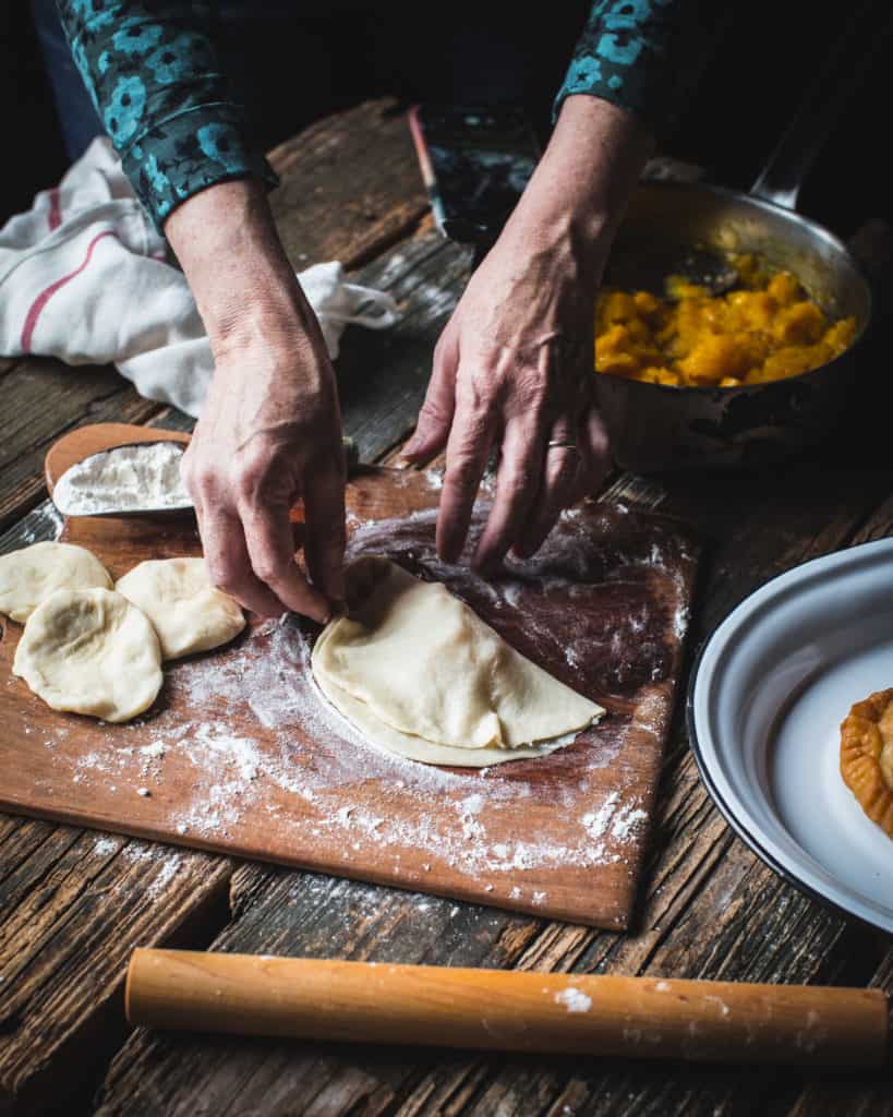 hands folding pastry