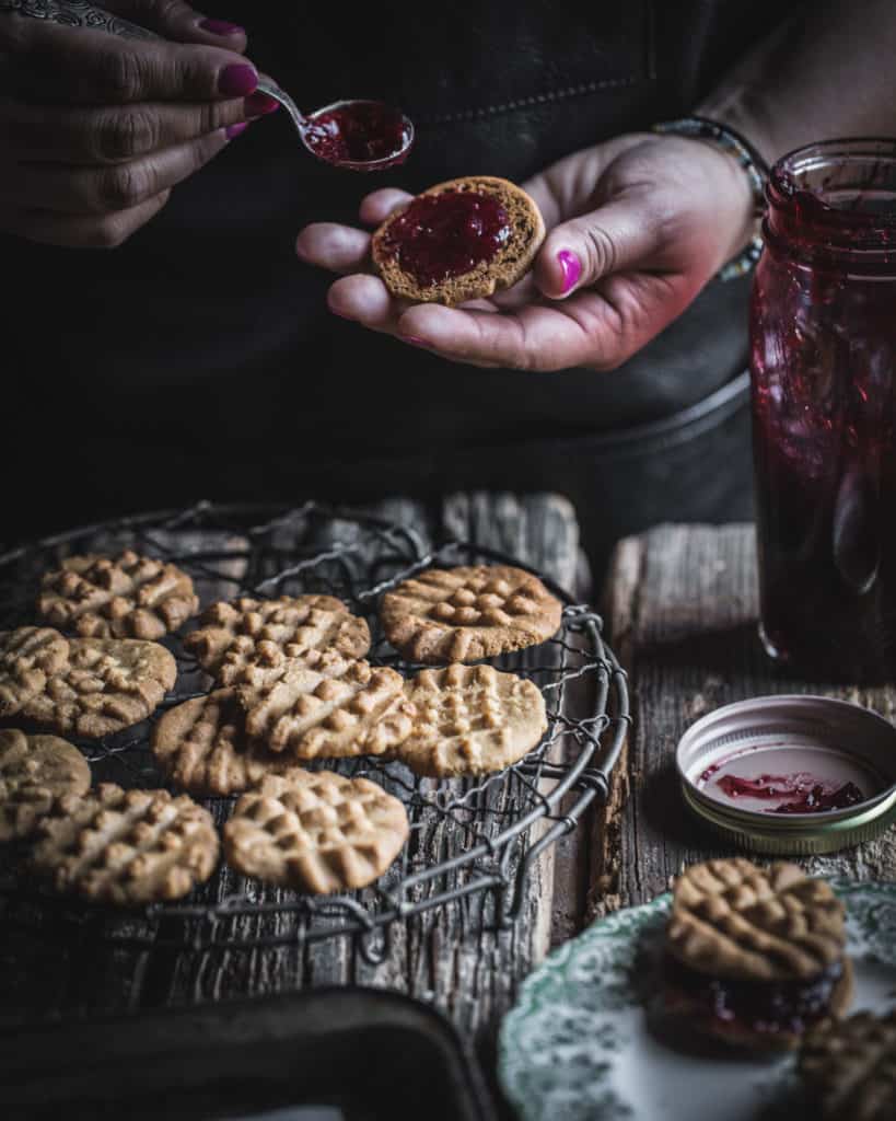 hands filling cookies