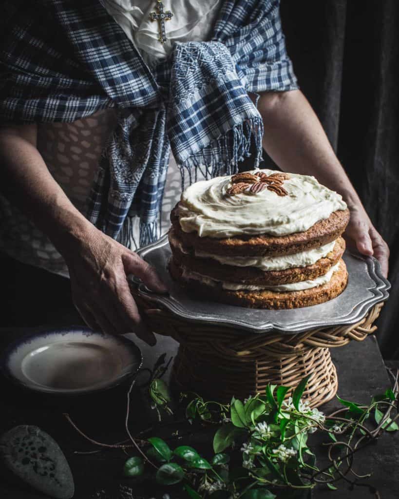 hands with whole cake