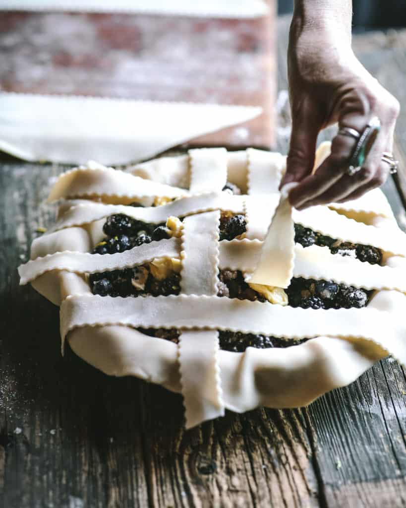 hands arranging pie crust