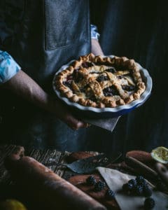 hands holding pie