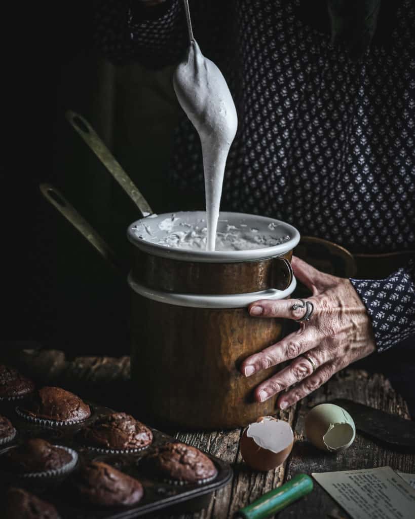 Hand with pot of frosting