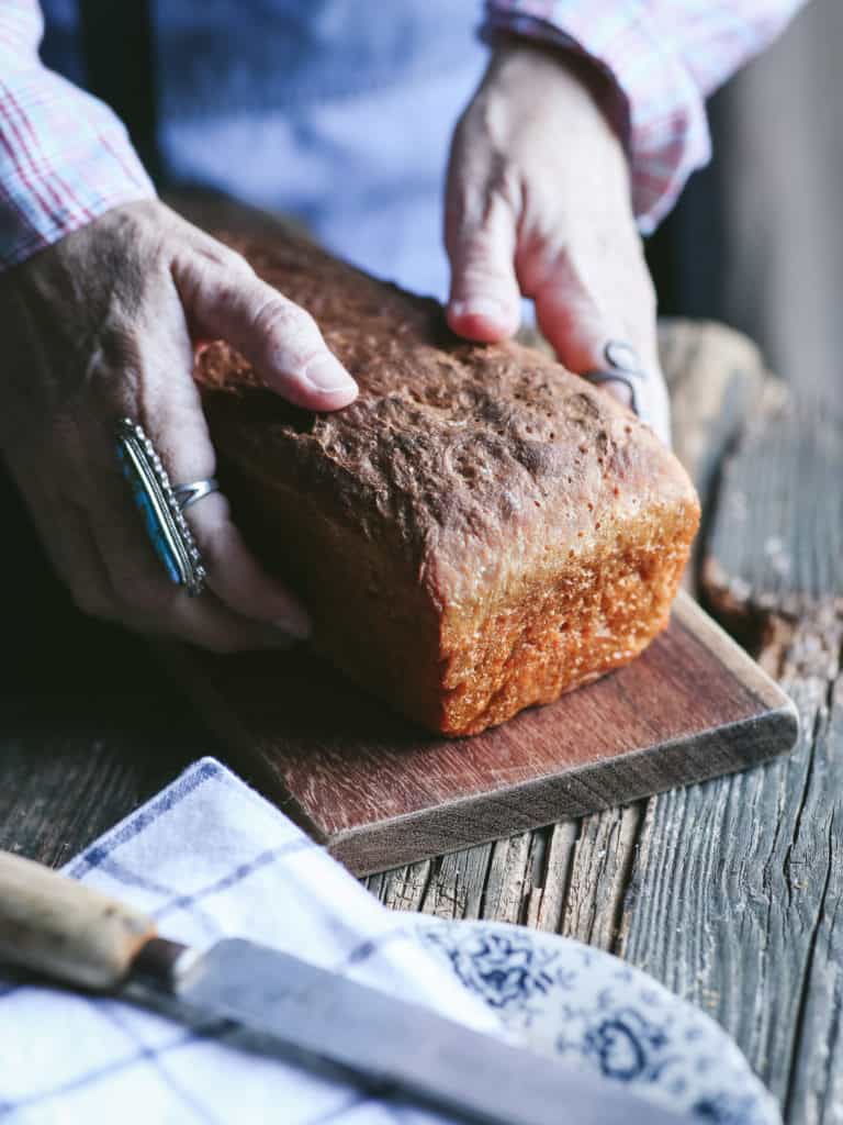 hands with bread loaf