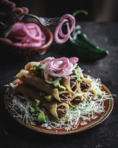 plate of rolled tacos