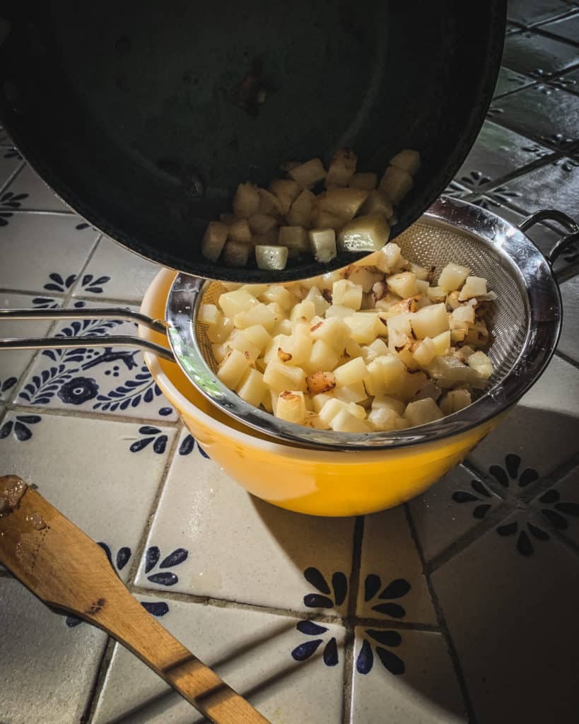 draining potatoes in strainer