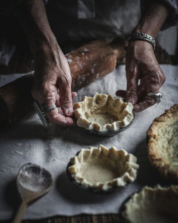 hands with tart crust