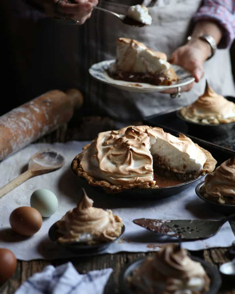 woman serving chocolate pie