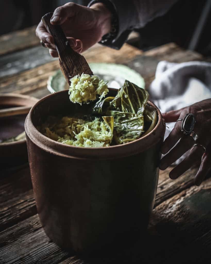 Hand with spoonful of sauerkraut