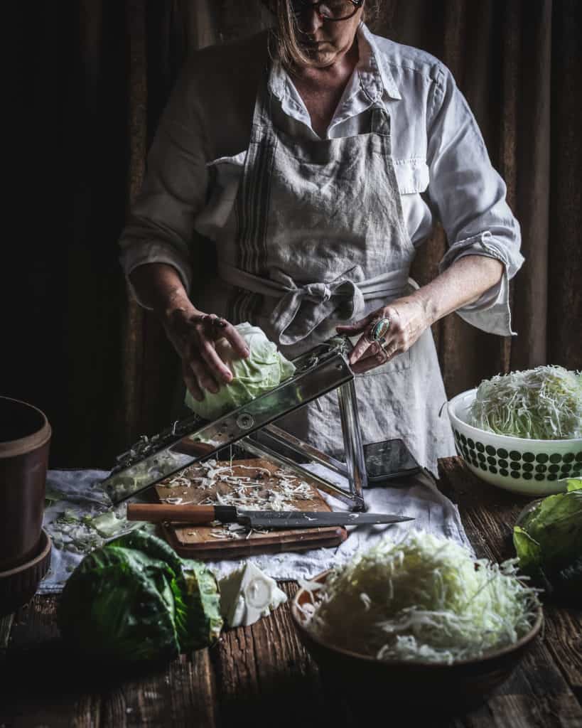 woman shredding cabbage