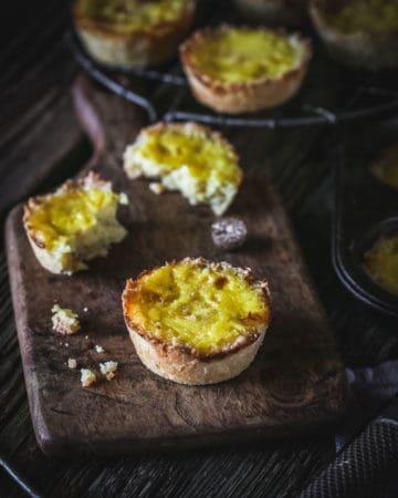 custard tarts on wooden board