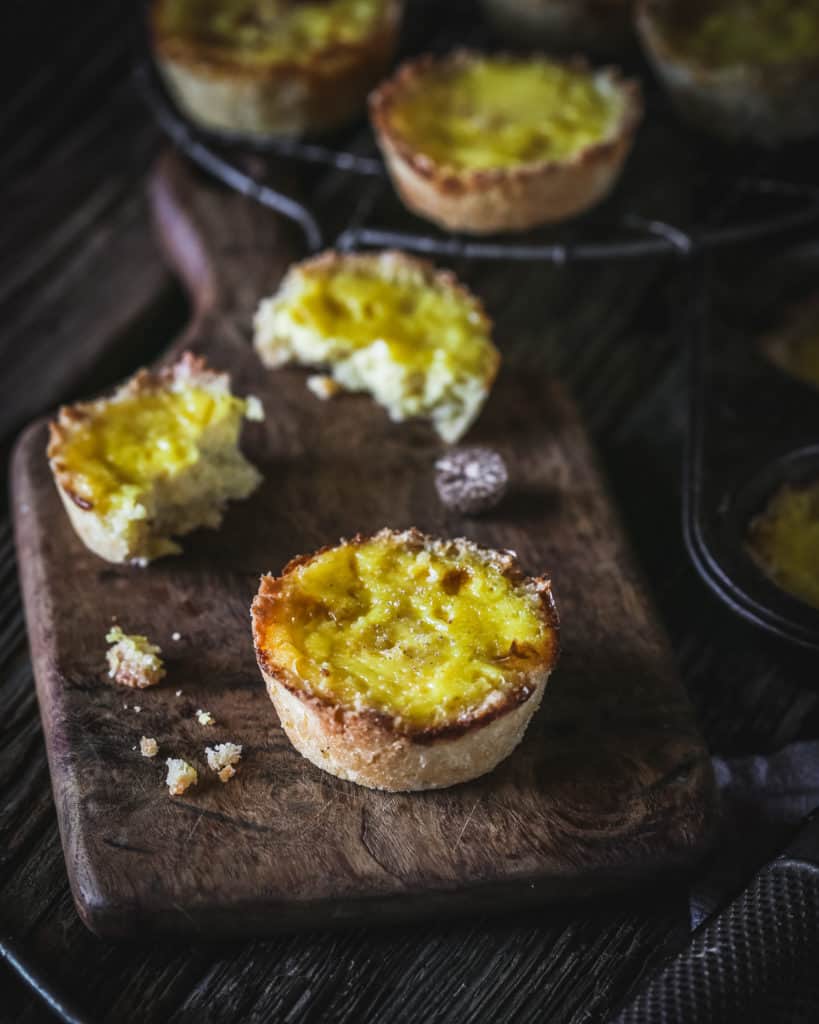 pastel de nata on wooden board