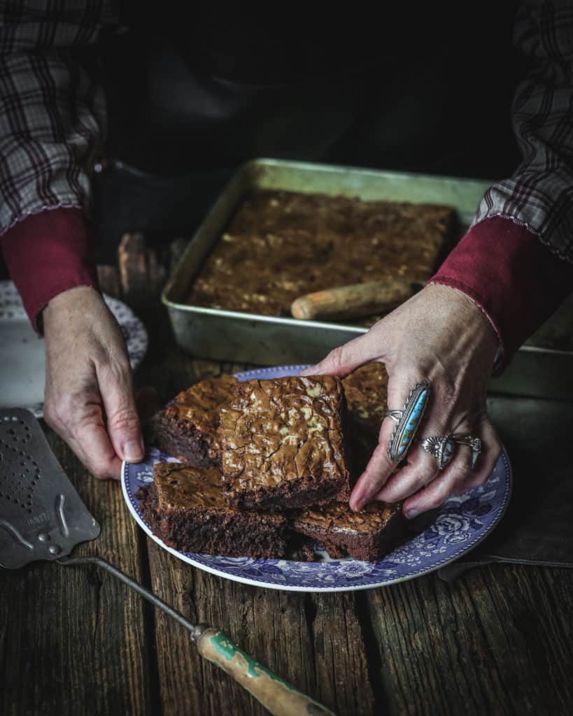 hands presenting brownies