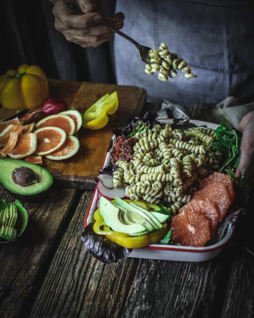 dish of pasta salad with pesto