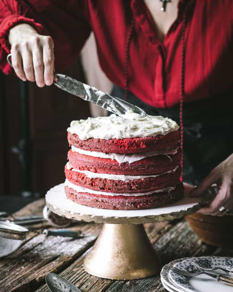 woman frosting cake