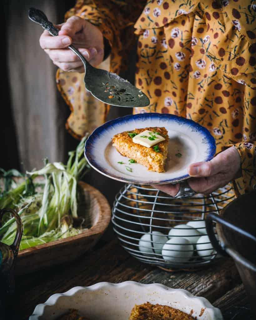 woman with plate of corn bread