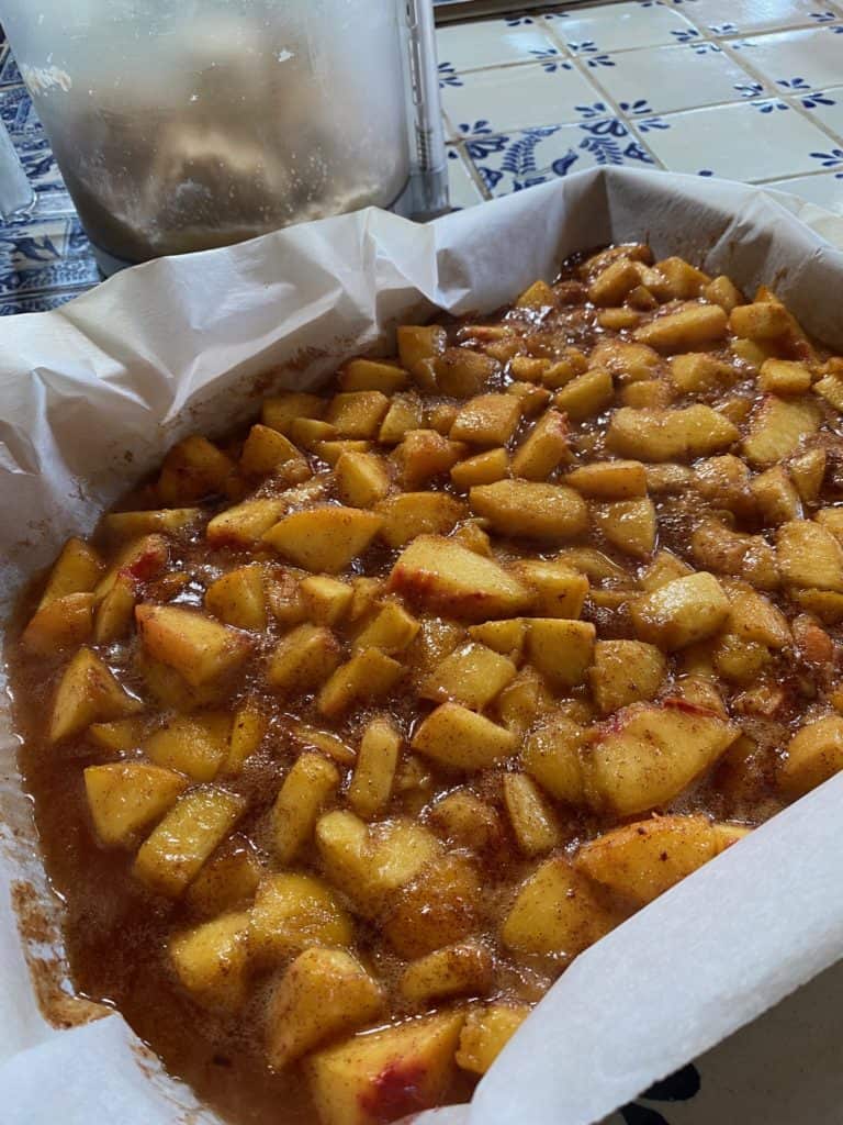 baking pan of cooked peaches