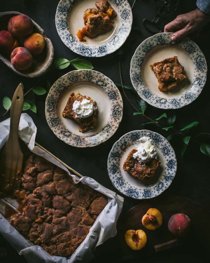 overhead of peach cobbler plates