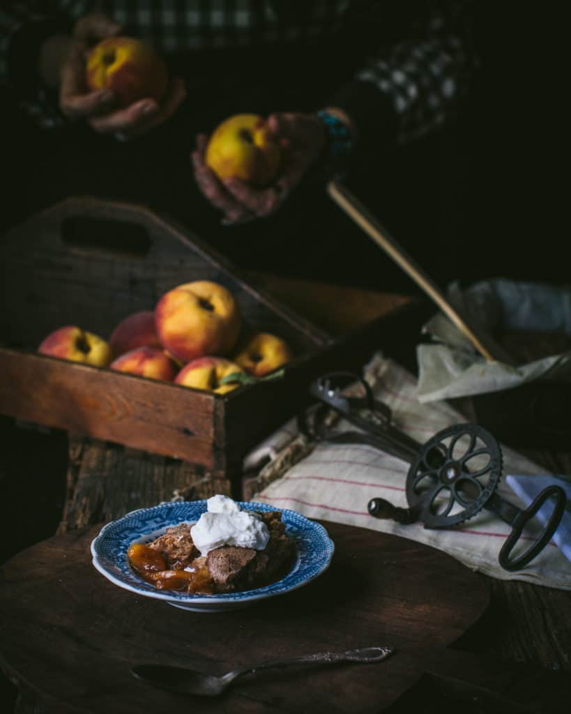 woman holding peaches