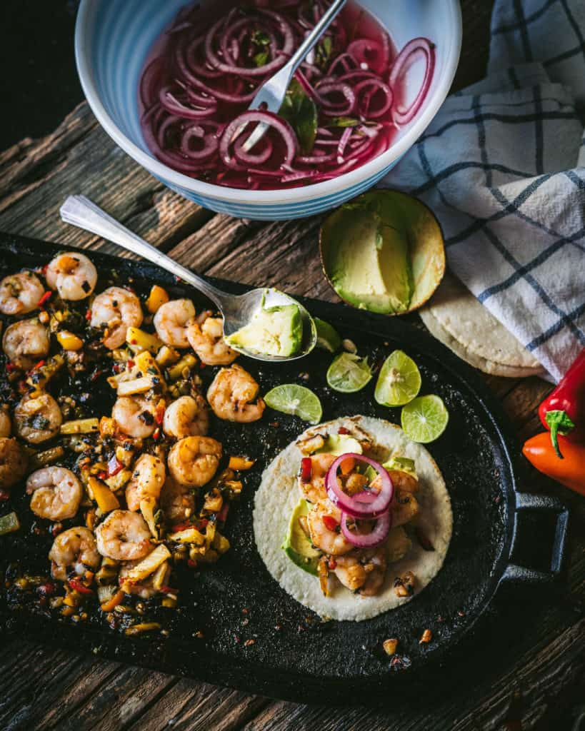 table with cooked shrimp and onions