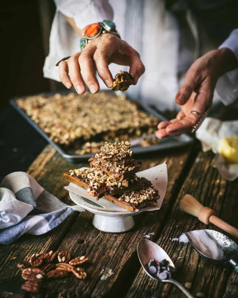 woman serving double pecan chocolate toffee